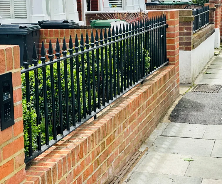 Metal fence panel at front of a house